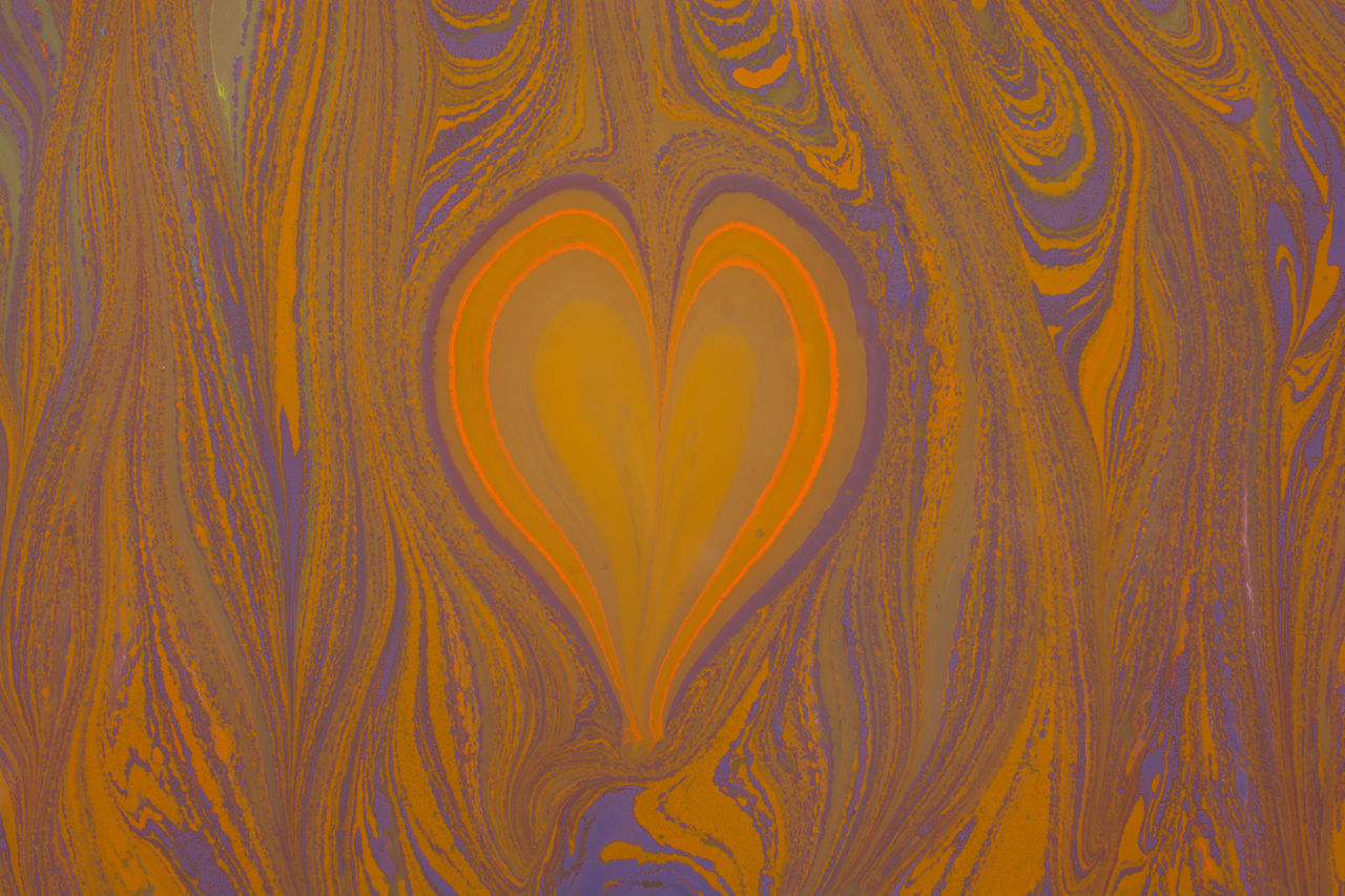 FULL FRAME SHOT OF MULTI COLORED HEART SHAPE MADE OF ORANGE ABSTRACT PATTERN