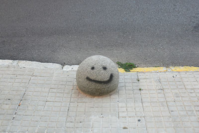 High angle view of stone on footpath