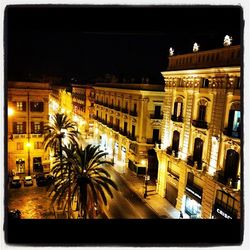 Buildings in city at night