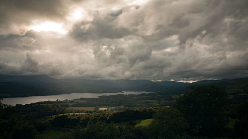 Scenic view of mountains against cloudy sky