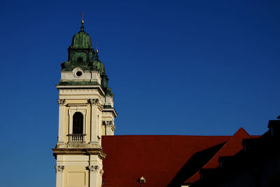 Low angle view of church against clear blue sky