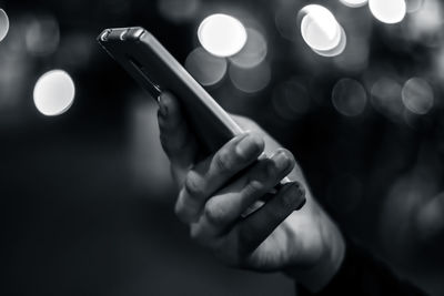 Close-up of man using mobile phone