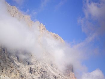 Low angle view of majestic mountain against sky