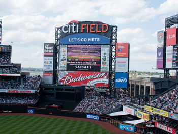 Information sign against sky