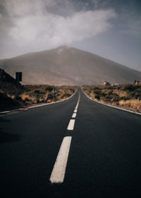 Empty road along landscape