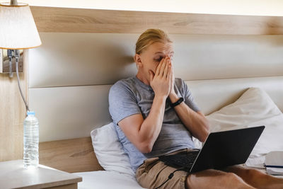 Businesswoman using laptop at home