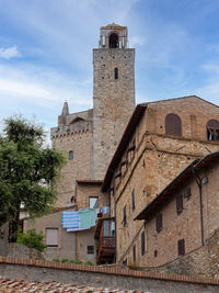 Details of bell towers and brick houses in san gimignano in tuscany, siena - italy.