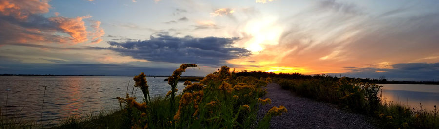 Scenic view of lake against sky during sunset