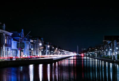 Reflection of illuminated buildings in water