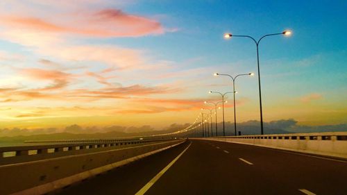 Road against sky during sunset