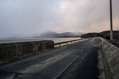 Empty road against sky