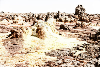 Rock formations in desert against sky