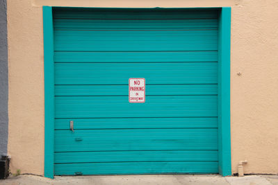 Information sign on closed door of building