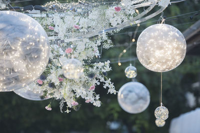 Low angle view of lighting equipment hanging from ceiling