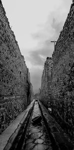 Black and white perspective shot of the streets of ancient pompeii 