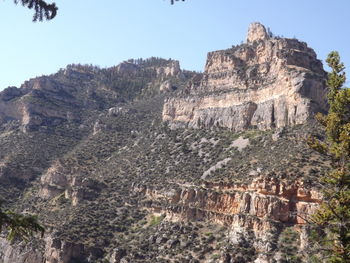 Scenic view of cliff against sky