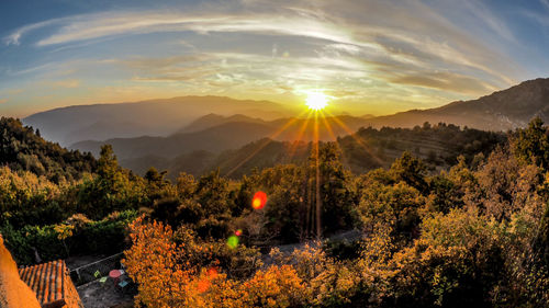 Scenic view of mountains against sky during sunset