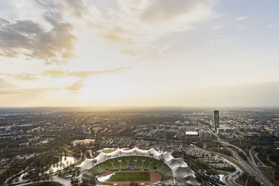 High angle view of buildings against cloudy sky