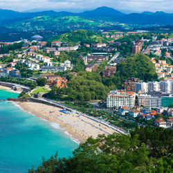 High angle view of townscape by sea