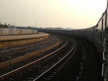 Railway tracks against clear sky