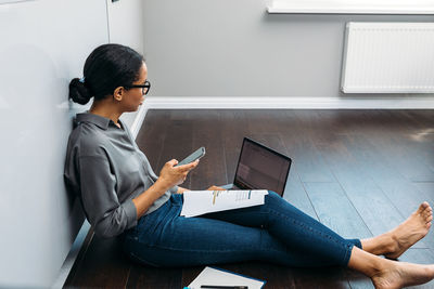 Woman working on laptop at home