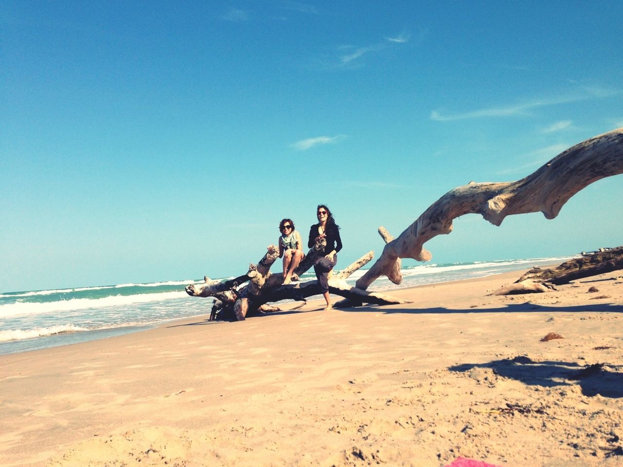 beach, sand, leisure activity, lifestyles, sea, shore, vacations, water, full length, men, enjoyment, togetherness, sky, nature, fun, sunlight, blue