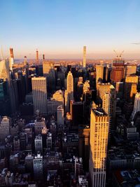 Aerial view of city buildings during sunset