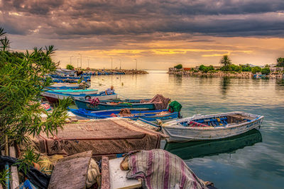 Boats moored at harbor