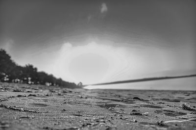 Surface level of beach against sky