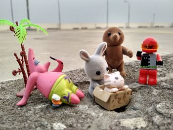 Toys on old concrete wall