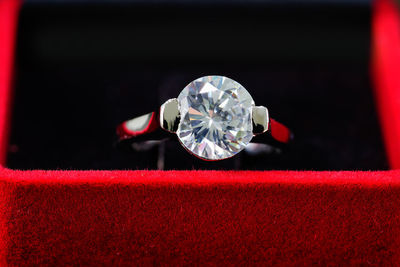 Close-up of ring on red background