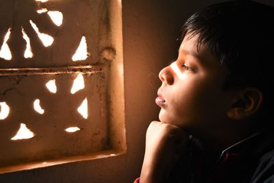 Close-up portrait of boy looking away