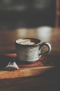 Close-up of coffee cup on table