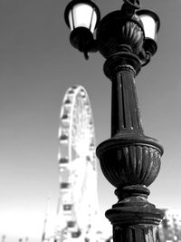 Low angle view of street light against sky