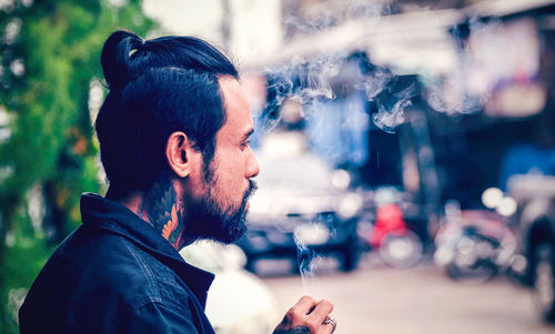 Portrait of young man looking away