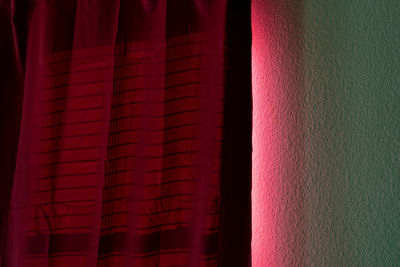 Close-up of curtain against wall at home