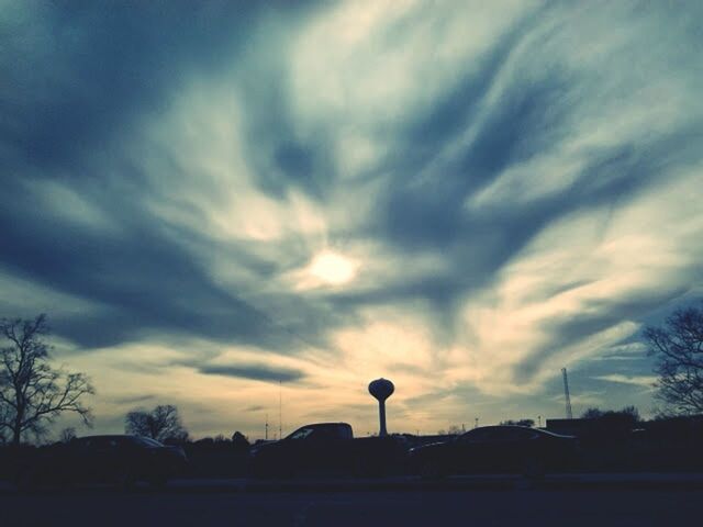 silhouette, sky, sunset, cloud - sky, tree, cloudy, street light, cloud, tranquility, beauty in nature, dusk, nature, scenics, tranquil scene, low angle view, dramatic sky, road, outdoors, transportation, no people