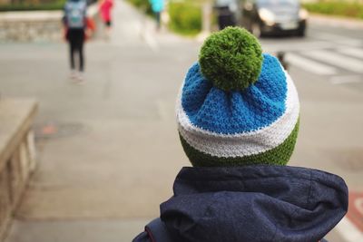 Rear view of person wearing knit hat