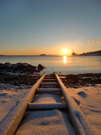 Scenic view of calm sea at sunset