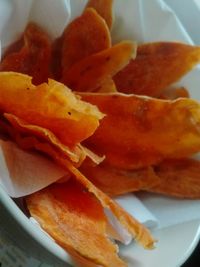 Close-up of orange slice in plate