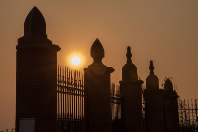 Silhouette of building during sunset