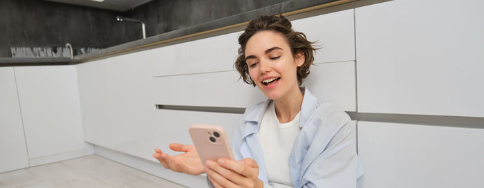 Young woman using mobile phone