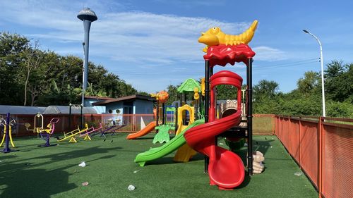 View of playground against sky in park