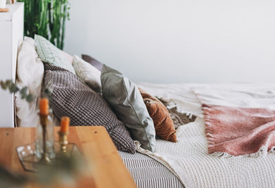 Close-up of pillows on bed at home