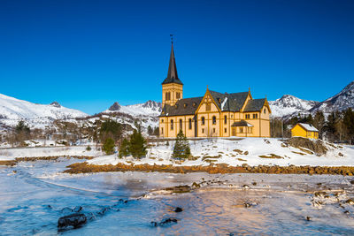 View of building against blue sky during winter