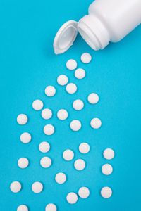 High angle view of blue paint on white background