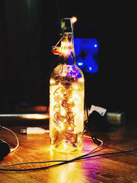 Close-up of glass bottle on table