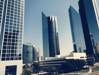 Low angle view of modern buildings against clear sky