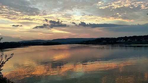 Scenic view of lake at sunset