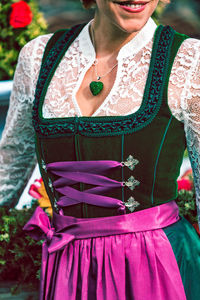 Midsection of woman wearing dirndl